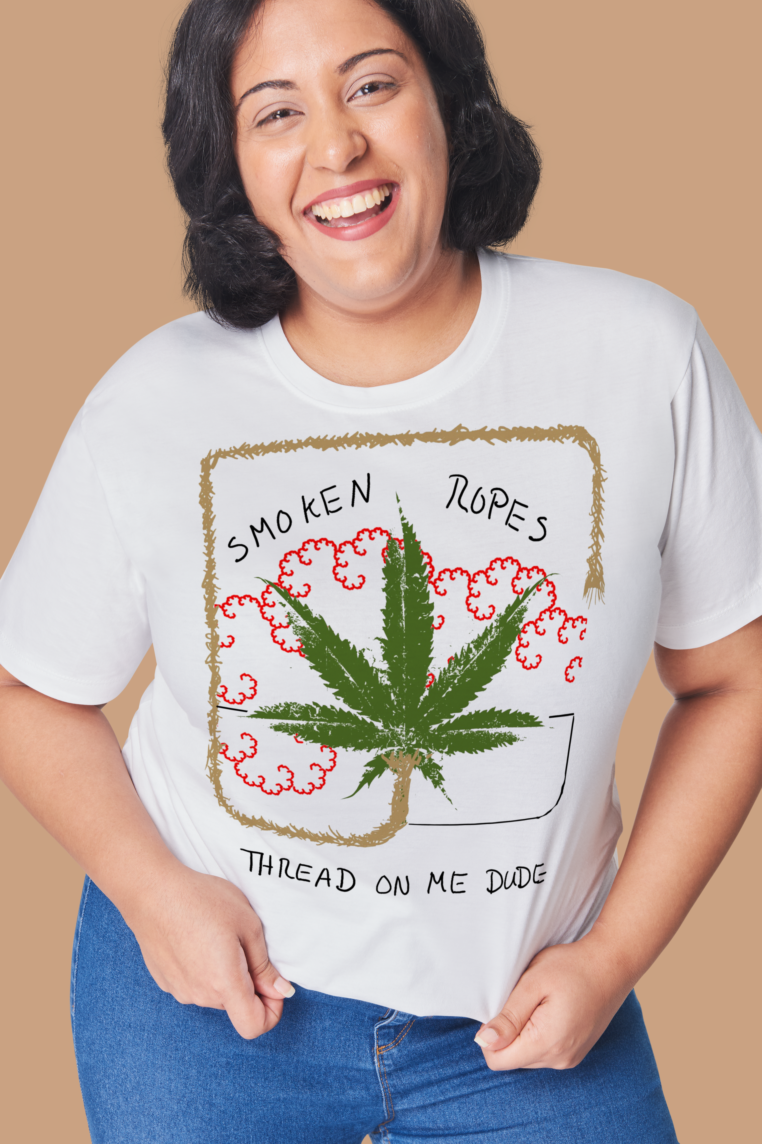 Person wearing a white t-shirt with a graphic design featuring a cannabis leaf and text.